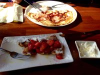 Breakfast in Amsterdam  Profflitores with strawberries for me, pancakes with ham for Anna