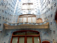 Casa Batllo  Gaudi designed house.  Light well.  Colors get darker and windows smaller as go up.